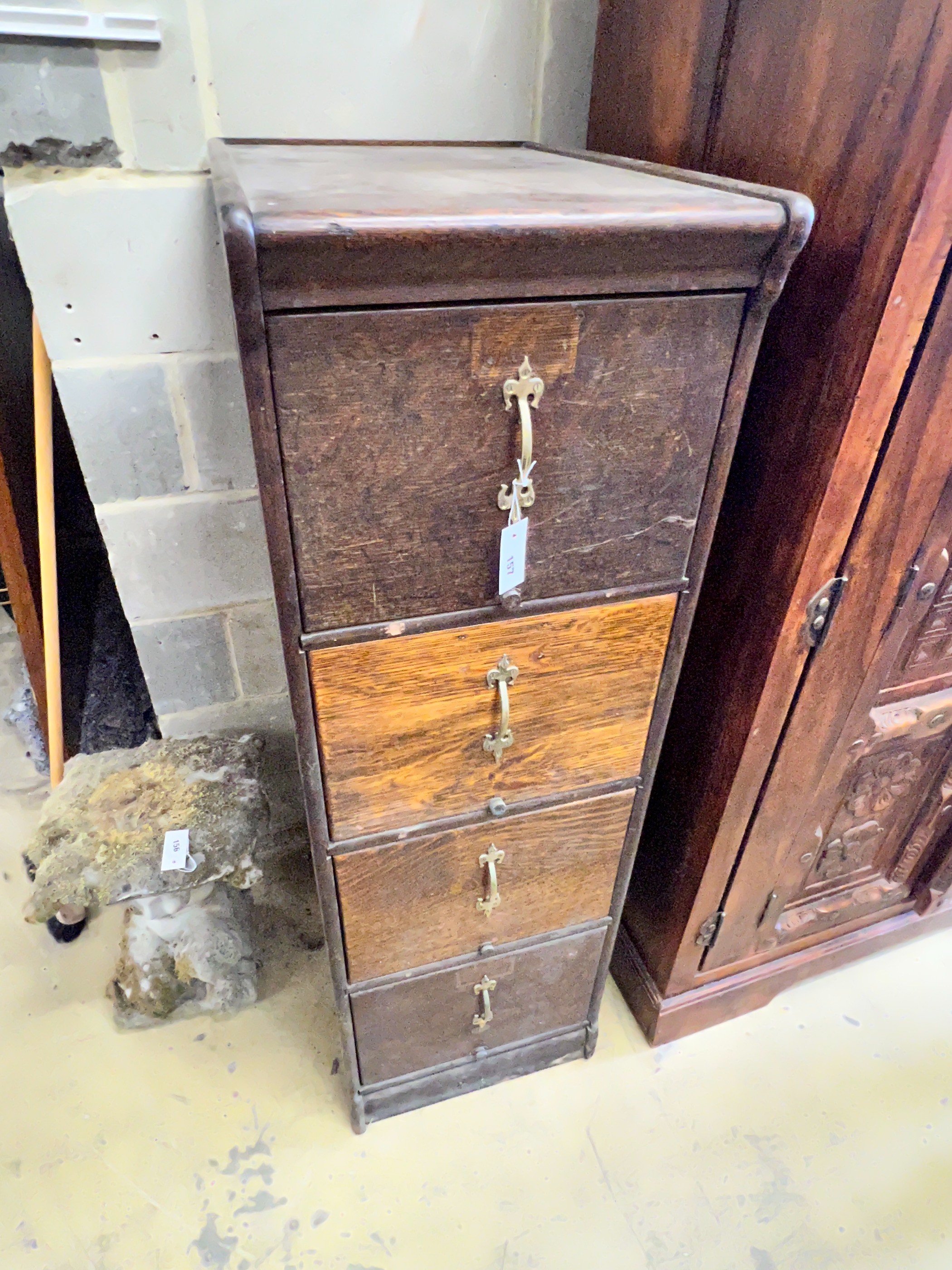 An early 20th century oak four drawer filing cabinet, width 45cm, depth 64cm, height 141cm